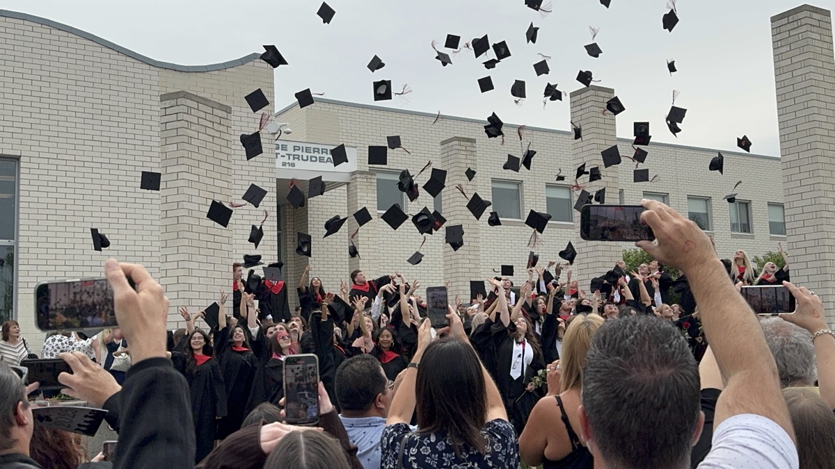 Sheri at a school graduation ceremony