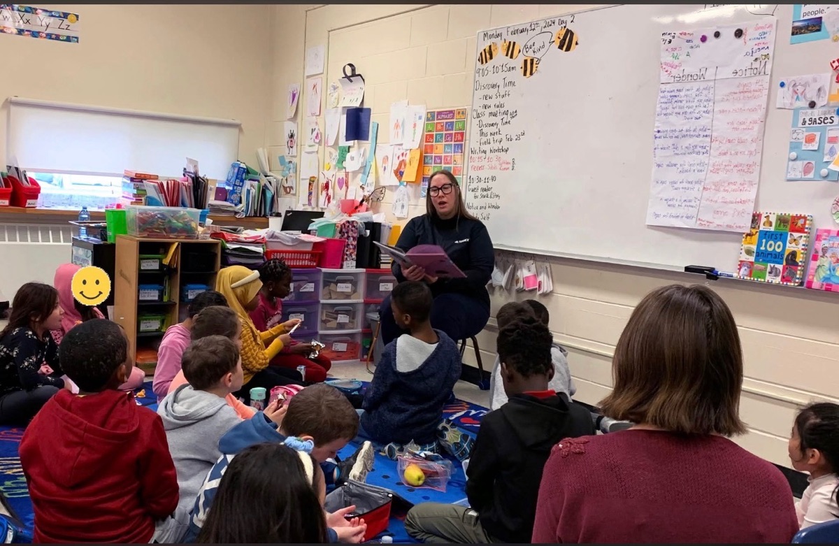 Sheri reading with students during I Love to Read month